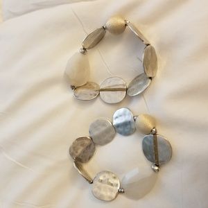 silver and neutral bracelets